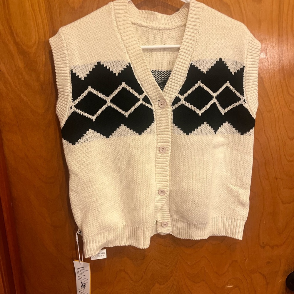 Knitted vest.